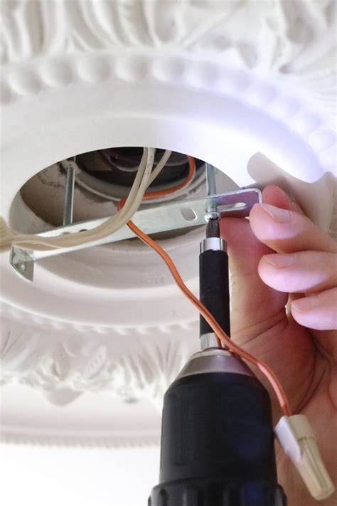 how to cover a chandelier junction box ceiling medallion|fixing a ceiling medallion.